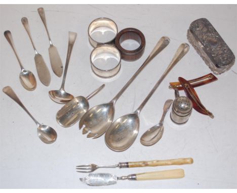 Assorted silver wares to include pair salad servers, pair napkin rings, sauce ladle, caddy spoon, etc
