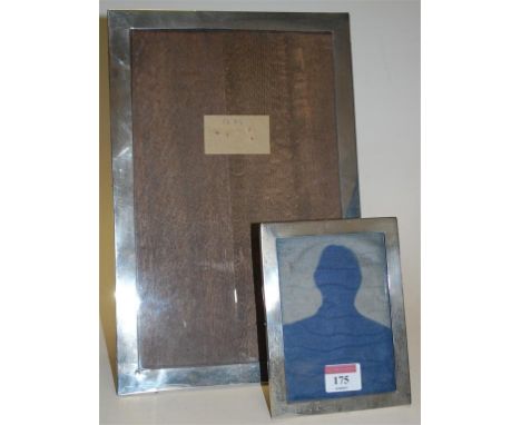 A large plain silver easel photograph frame and one other smaller example (2)