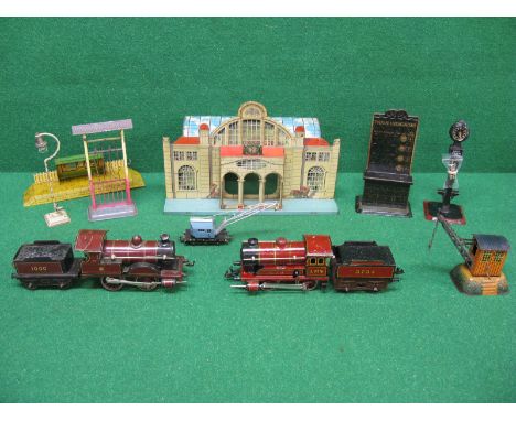 Bing, Marklin & Hornby tinplate O gauge railway items to comprise: station with curved roof, train indicator, two train desti