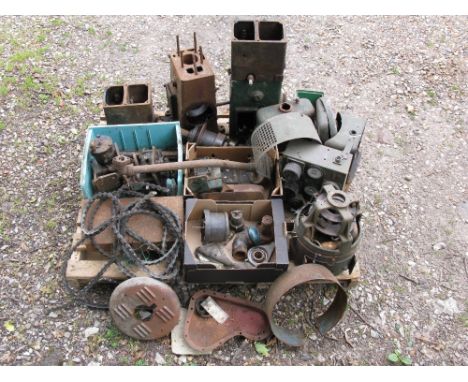 This lot comprises two dismantled Lister D hopper cooled stationary engines, parts of an Onan dynamo plus a quantity of unkno