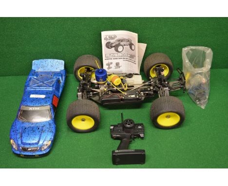 XTM Racing, a Mammoth ST radio controlled buggy with 4cc glow plug engine, body, hand control, accessories and instructions