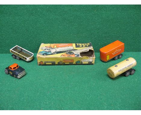 ALPS Made In Japan Truck set comprising tinplate friction drive tractor unit with three different trailers, boxed (damaged)