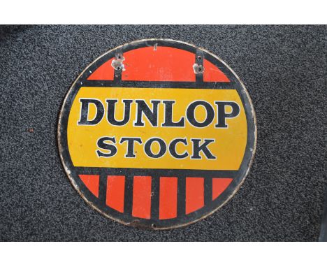 Round double sided enamel advertising sign for Dunlop Stock, black letters on a red and yellow ground - 24" in dia (one side 