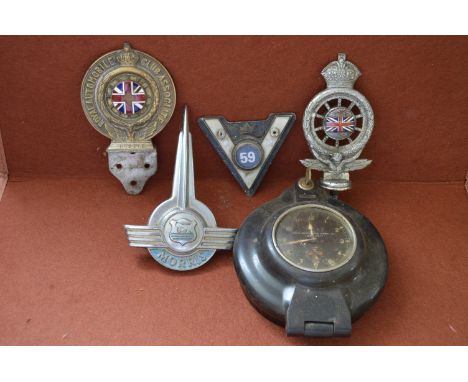 Two RAC bumper badges with Union Flag enamel to centre, Morris bonnet badge, metal VM 59 badge and a Bakelite cased clock wit