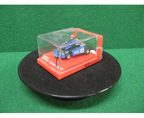 Battery powered revolving turntable for item display together with a Michael Schumacher go-cart radio