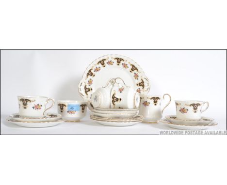A 20th century Staffordshire vintage chintzy bone china tea service by Balmoral. To include trio's, side plates etc