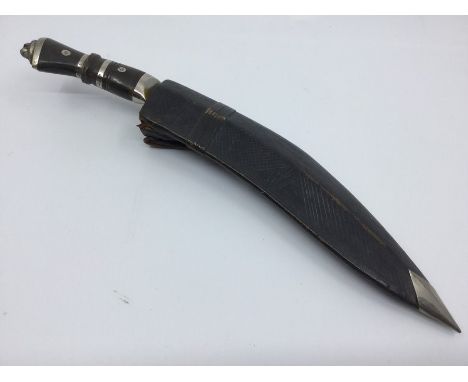 A Gurhka Kukri Knife with 24cm punch mark decorated plated blade. Horn grip. Lions head pommel. Overall length 33cm. Complete