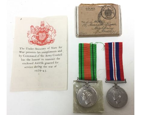 WW2 British Army medal group comprising of War Medal 1939-45 and Defence Medal, complete with original ribbons, slip and box 