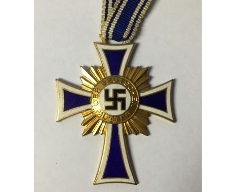 WW2 Third Reich&nbsp;Ehrenkreuz der Deutschen Mutter.&nbsp;Mothers Cross in Gold. Complete with full length original ribbon. 