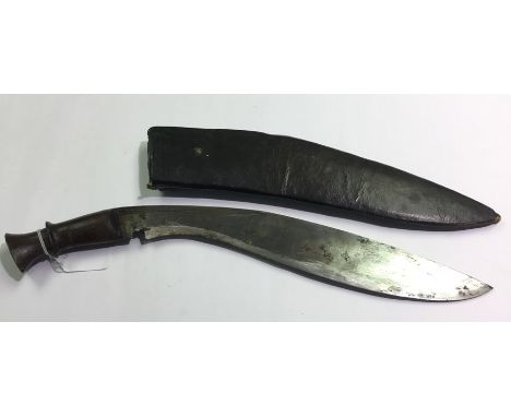A Gurhka Kukri Knife with 335mm long blade. No markings. Wooden grip. Overall length 420mm. Complete with wooden scabbard wit