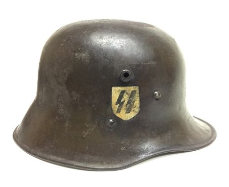 WW1 Imperial German Army M17 Steel helmet. Original paint, but with additional painted Waffen SS insignia (not decals) done p