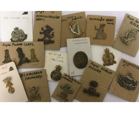 A large collection of over 80 restrike British Army cap badges. WW1, WW2 and post war pattern badges. To include Tank Corps, 