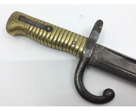 French 1866 Pattern Chassepot Bayonet with fullered single edged blade 57cm in length. Dated to spine 1874. Overall length 70