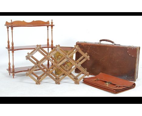 A collection of items to include a very good vintage leather suitcase, a an attache case, small what not wall shelf, a retro 