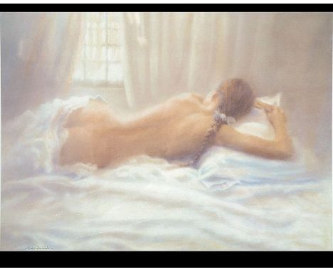 A framed and glazed limited edition signed print of a scantily clad recumbant reclining nude. Signed and numbered to the marg