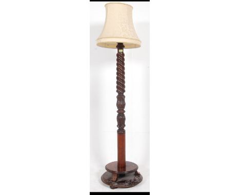 A good early 20th Century Wooden Standard Lamp with barley twist carved column, Art Nouveau carving and associated shade. Mea