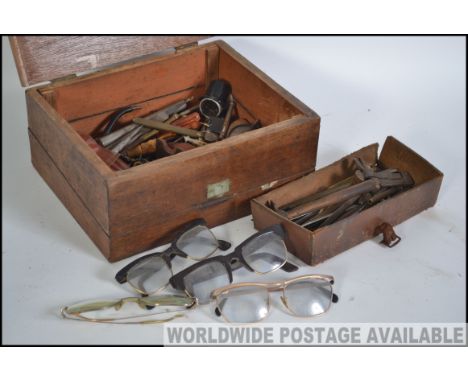 A collection of vintage tools set within engineers wooden box, believed to be that of a watch repairer. Measures: 26cms wide.