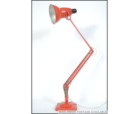 A 1940's Herbert Terry two step orange / red  anglepoise Industrial desk lamp having square terraced base with pendant shade.