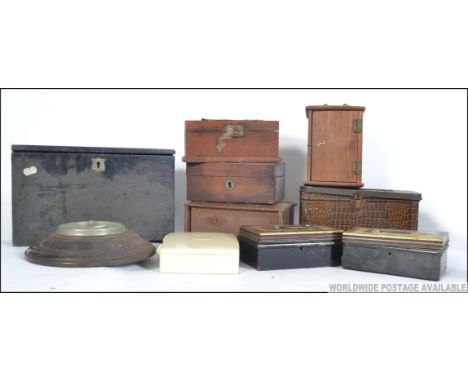 A collection of boxes and tins to include petty cash tins, wooden carriage clock case, wooden desk tidy with appointed interi