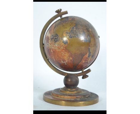 A 1930's Art Deco Rensie Globe German Alarm Clock in brass case with opening movement. Measures: 11cms high. 