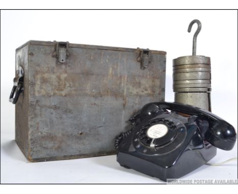 A group of items to include a vintage set of European ring weights, ring dial telephone and a military wooden case.