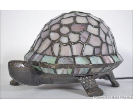 A 20th century Tiffany inspired desk lamp in the form of a Tortoise, the base being constructed from cast metal with a a mott