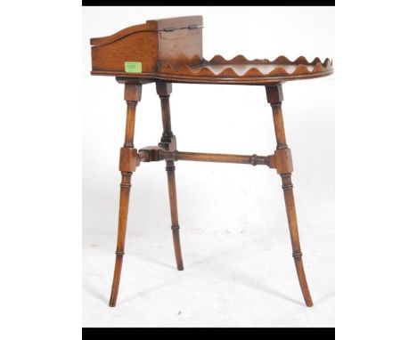 A 19th century fine mahogany butlers assistant table raised on faux bamboo supports having a scalloped edge table top with hi