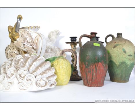 A collection of ceramics to include a large wall pocket of oyster form a carp, wall mounted decanter, large vase with animal 