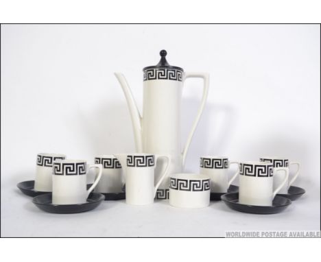 A retro 20th century Portmeirion coffee service for six in the Greek key pattern on a white back ground. Consisting of six cu