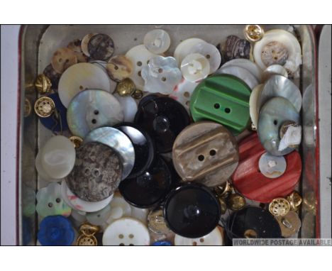 A collection of vintage and antique buttons to include a set of Jade buttons, glass buttons, glass belt buckle etc