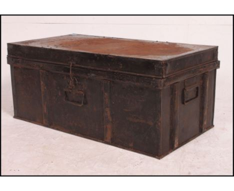 A Victorian 19th century ebonised metal steamer chest / trunk with carry handles and hinged top above.