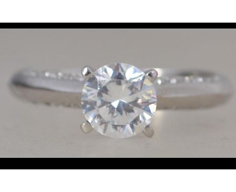 A silver large claw mounted round cut cz adorned ladies engagement ring. Size R.5 / Weight 3.5g