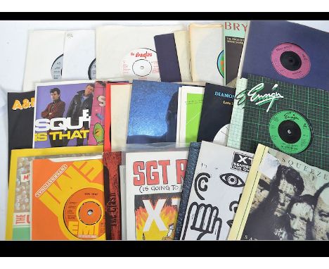 A collection of 45rpm vinyl 7" singles to include Roxy Music, Elvis Costello, Ian Dury &amp; The Blockheads, Boomtown Rats, S