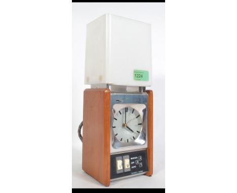 A retro 1970's Russell Hobbs alarm clock light in teak case with shade. Model No 7002. Measures: 32cms high.