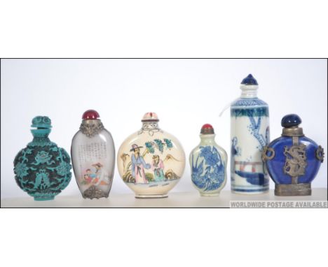 A collection of Chinese snuff - perfume bottles to include glass, blue and white ceramic, white metal embellished, faux turqu