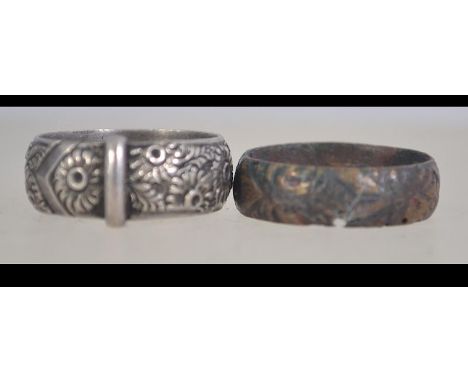 A Victorian silver buckle band ring with foliate decoration. Hallmarked Birmingham 1890.  Maker P.B. Weight 6.4g. Size R. Tog