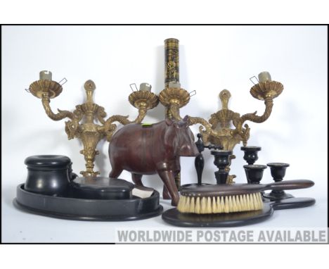 A vintage 20th century Ebony dressing table set consisting of candle sticks, pots, ring stand, hat pin holder, tray etc along