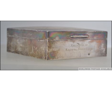 A silver hallmarked wooden lined desk cigarette box having engine turned design with AJN 1936 ( Arthur John Newbury Naval Att