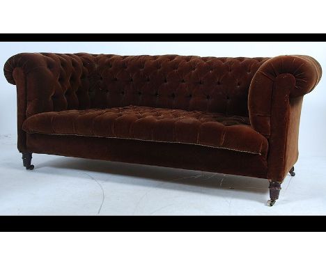 A stunning 19th century Victorian button back and button seat pad low back Chesterfield three seater sofa upholstered in brow