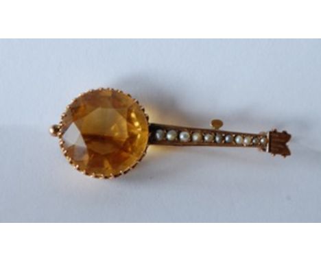 A 9ct gold Victorian brooch pin in the form of a Banjo with large prong set yellow tourmaline, approx 10cts, with a pierced g