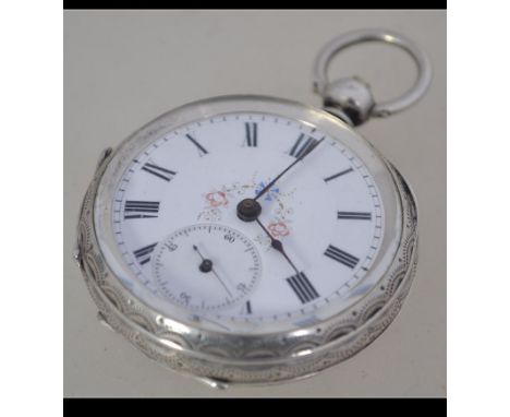 A Continental 800 silver ladies pocket watch with chase decorated design. Enamel face with a subsiduary dial.