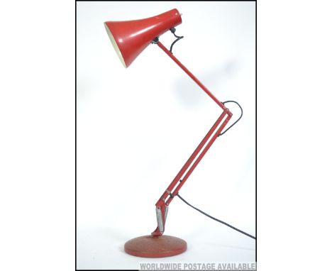 A vintage Herbert Terry  post war  anglepoise desk lamp in original red paint. Circular terraced base with pendant shade. Mea