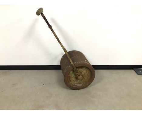 A vintage cast iron garden roller, drum measures 45cm wide 