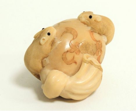 A Japanese Meiji period (1868-1912) or early Taisho (1912 - 1926) ivory netsuke in the form of rats mounting an egg,  the rat