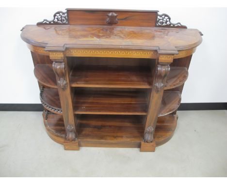A Victorian rosewood console bookcase, bow front with parquetry Greek key design to frieze, pierced and panel gallery, shelve
