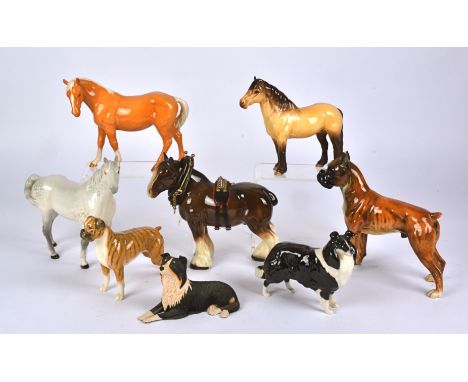 A quantity of Beswick and other collectable pottery figures of dogs,  horses and birds, to include a black Labrador, a Beswic