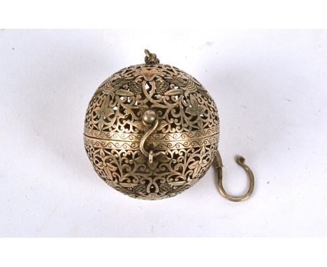 An Islamic white metal incense burner,  of pierced spherical foliate form, length on chain 12cm  