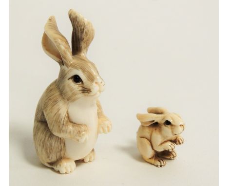 A Japanese Meiji period (1868-1912) or early Taisho (1912 - 1926) ivory netsuke in the form of an alert rabbit,  with delicat