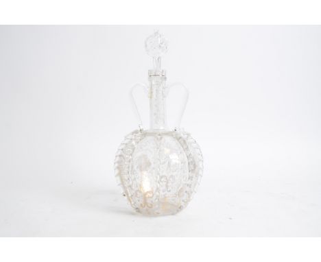 A Dutch twin handled glass decanter,   with fluted body and scrolling handles, gilt decoration of birds and grapes, rough pon