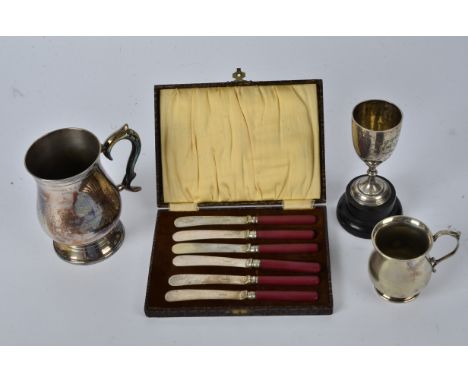 A George V hallmarked silver goblet awarded during the "Sergeant's' Shoot",   together with a plated set of knives and two ta